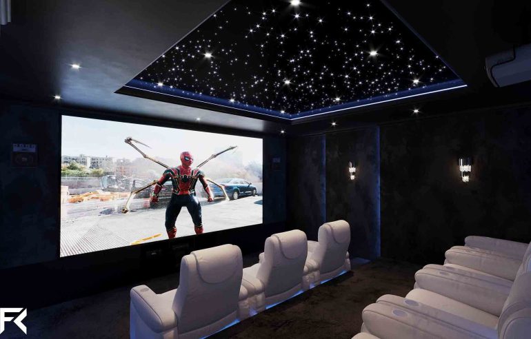 Fibre optic lighting in a luxury home cinema with star ceiling and recliner seating.