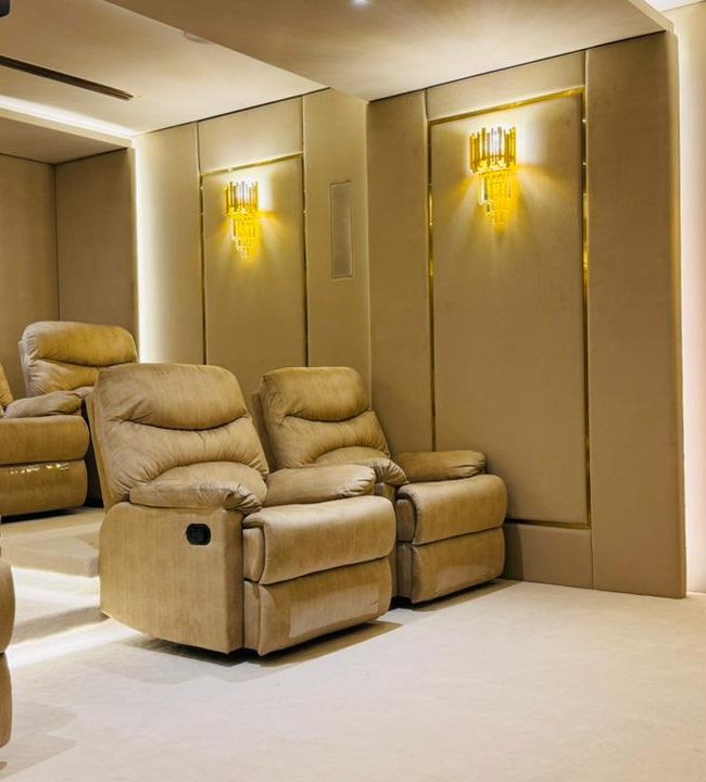 Custom home cinema design for luxury villas in Dubai with high-end seating, smart automation, and premium audio