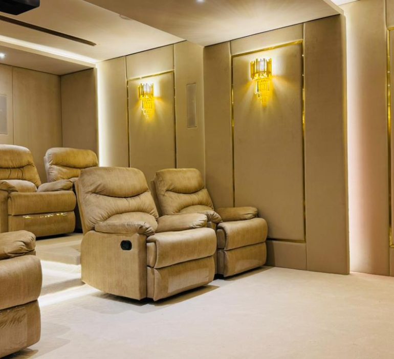 Custom home cinema design for luxury villas in Dubai with high-end seating, smart automation, and premium audio