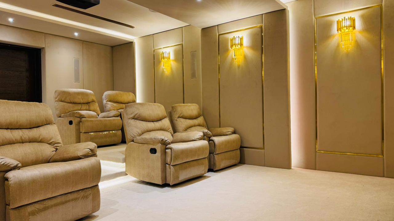 Custom home cinema design for luxury villas in Dubai with high-end seating, smart automation, and premium audio