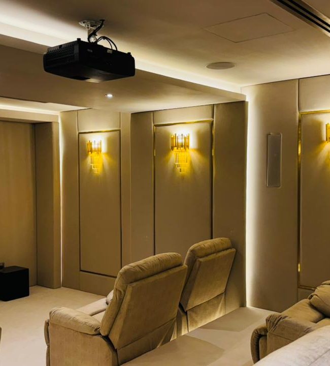 Modern private home cinema designed for family entertainment with premium seating and cinematic lighting.