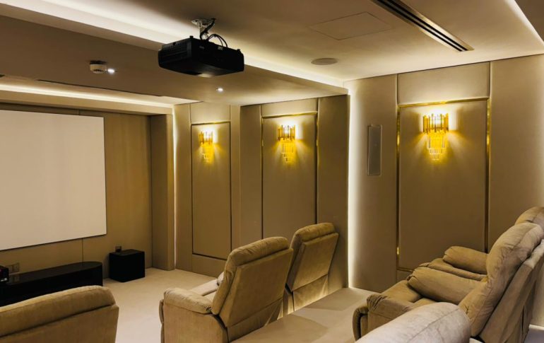 Modern private home cinema designed for family entertainment with premium seating and cinematic lighting.