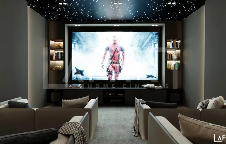Modern luxury home cinema featuring fibre optic lighting, plush recliner seating, and a cinematic star ceiling.