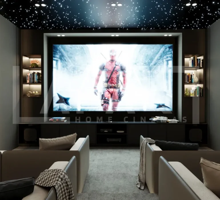 Why Fibre Optic Lighting is the Secret Ingredient for Luxury Home Cinemas 12 Modern home cinema room size with a large projection screen, luxury recliner seating, acoustic wall panels, KEF speakers, and fiber optic ceiling lighting.